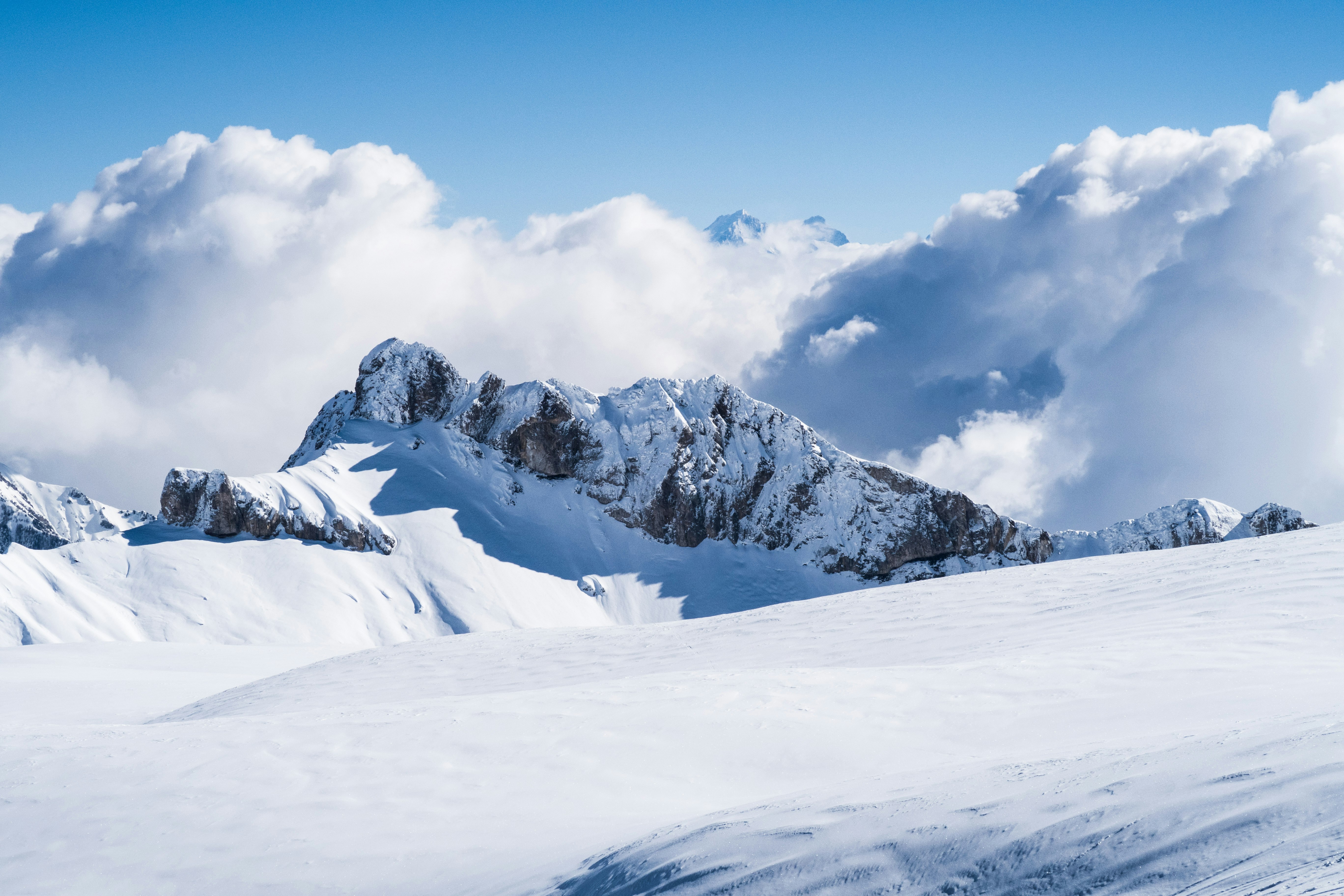 snow covered mountain under blue sky during daytime